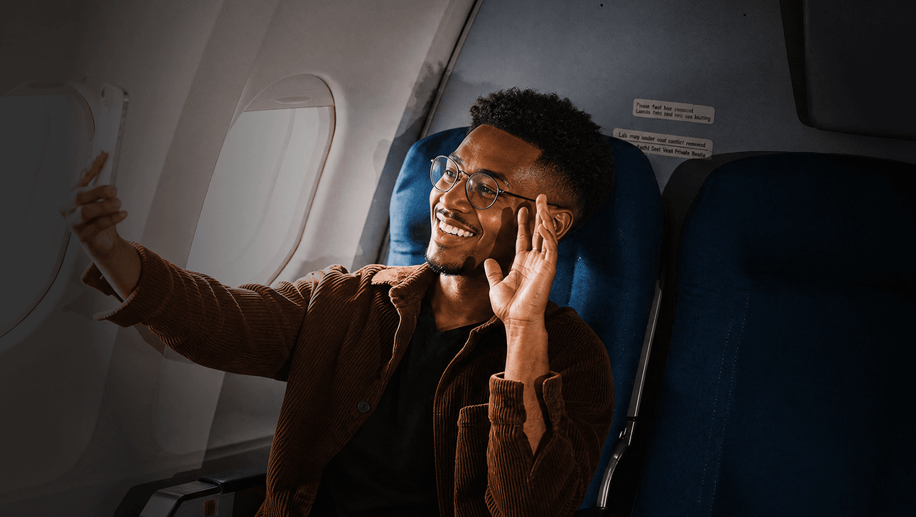 Traveller taking a selfie inside an aircraft
